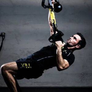 Photo of a man doing suspension training