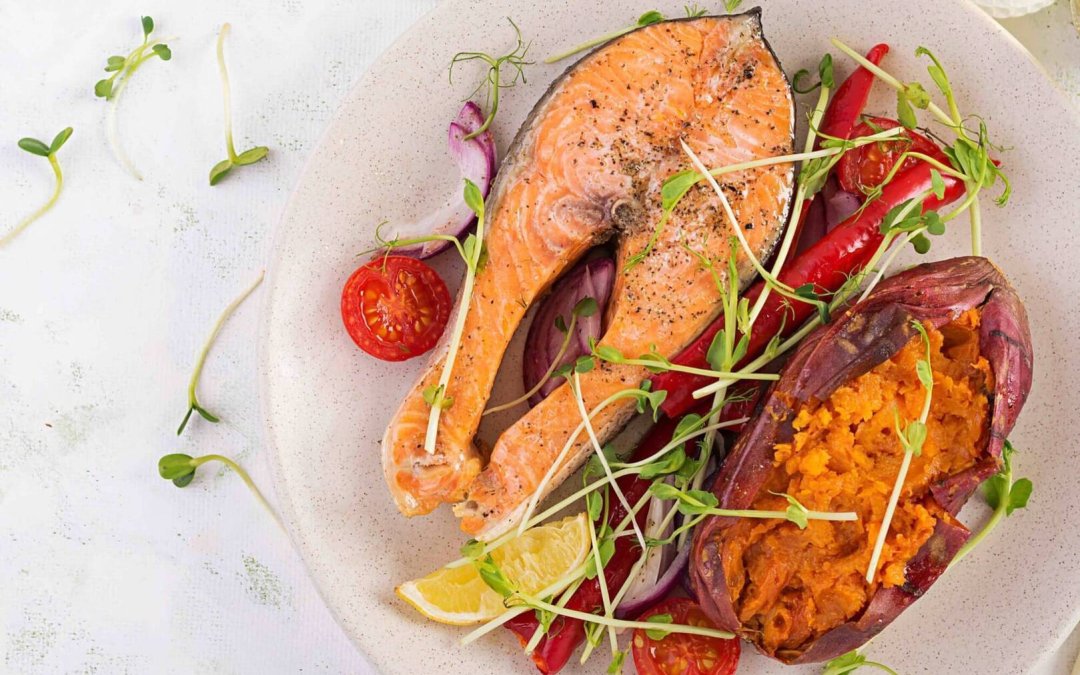 Healthy food: baked salmon and sweet potato and vegetables. Top view , overhead. Diet menu. Copy space